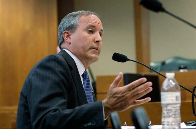 In this July 29, 2015 file photo, Texas Attorney General Ken Paxton speaks during a hearing in Austin, Texas.