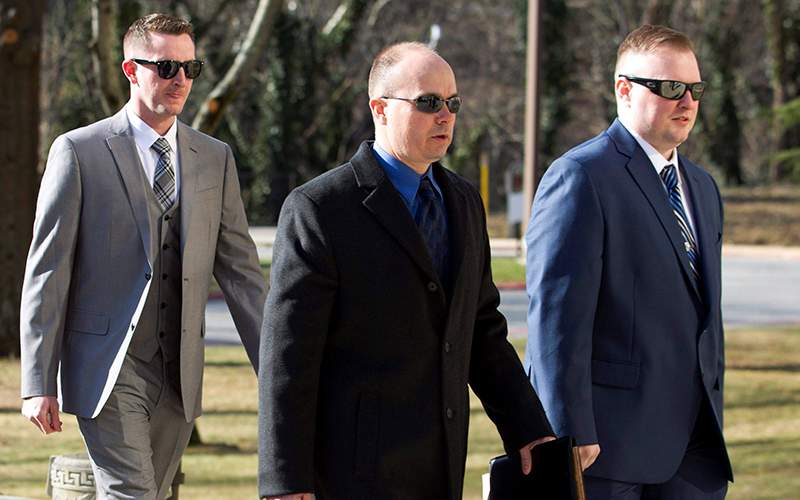 Officer Edward Nero, from left, Lt. Brian Rice and Officer Garrett Miller arrive to Maryland Court of Appeals on Thursday, March 3, 2016, in Annapolis, Md. 