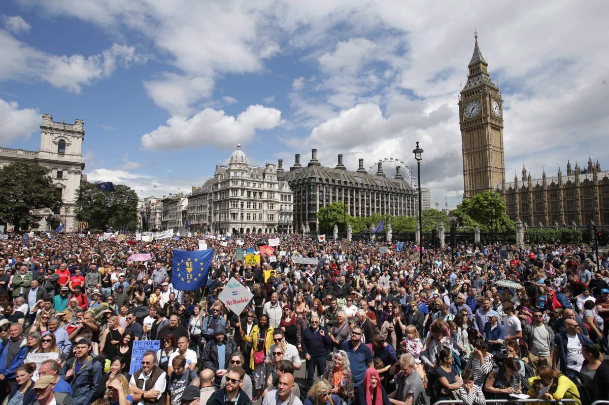 “Remain” supporters demonstrate in Parliament Square, London, to show their support for the European Union in the wake of the referendum decision for Britain to leave the EU, known as “Brexit”, Saturday July 2, 2016. Demonstrators wearing EU flags as capes and with homemade banners saying “Bremain” and “We Love EU” gathered on the streets for the March for Europe rally. At rear right is the Elizabeth Tower containing Big Ben.