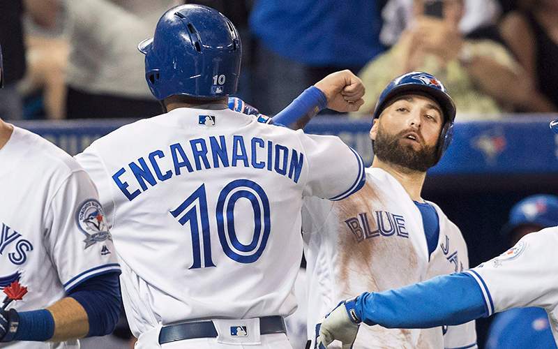 Toronto Blue Jays' Edwin Encarnacion, left, is congratulated by teammate Kevin Pillar after he hit a three run home run against the Detroit Tigers in the seventh inning of their American League MLB baseball game in Toronto Friday July 8, 2016. 