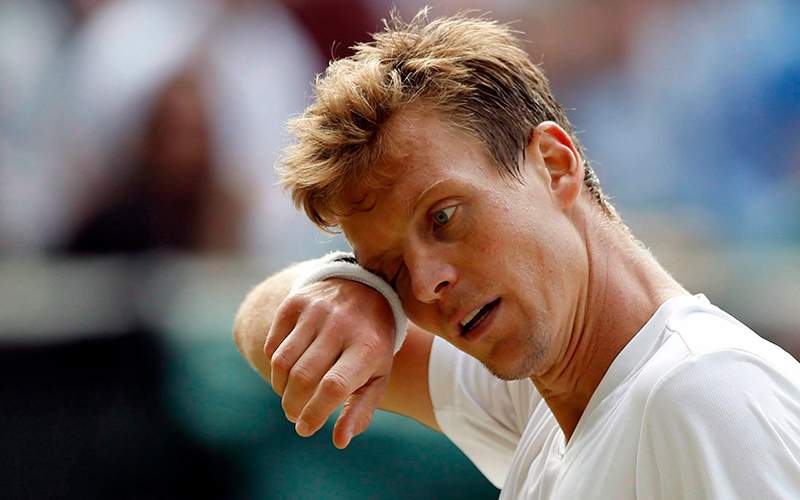 Tomas Berdych, of the Czech Republic, wipes his face during his men's semifinal singles match against Andy Murray, of Britain, during day twelve of the Wimbledon Tennis Championships in London, in a July 8, 2016. 