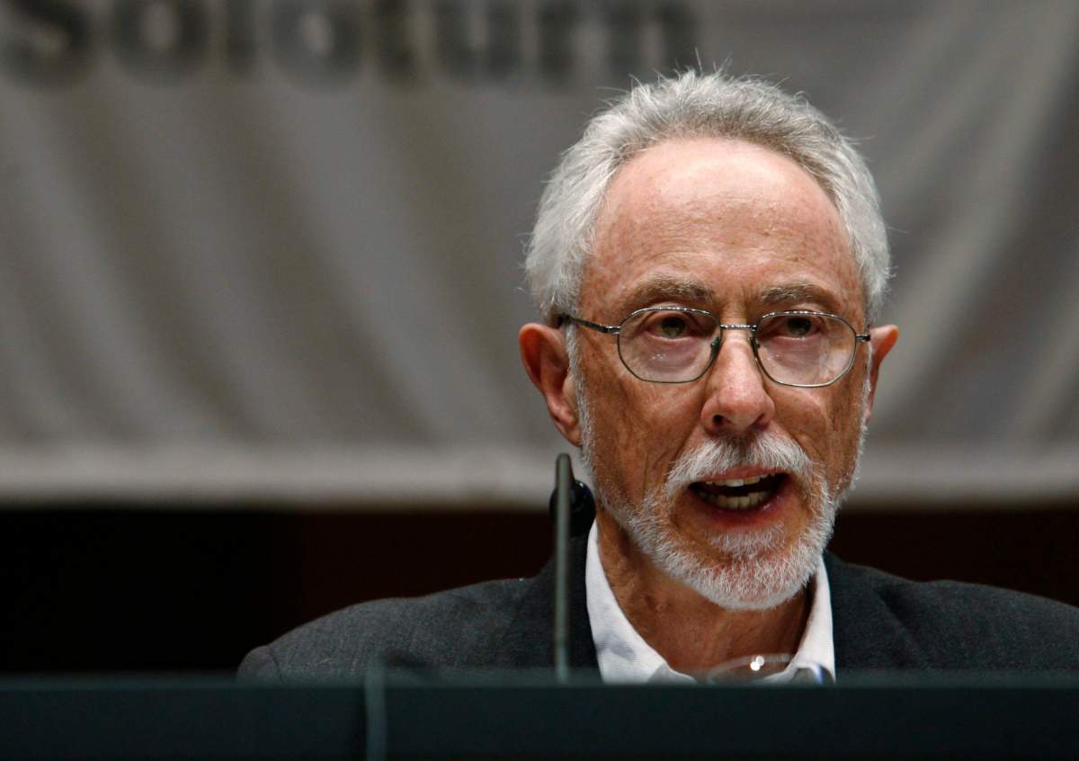 FILE- In this May 27, 2006 file photo, South African novelist, recipient of the 2003 Nobel Prize in Literature,  John M. Coetzee reads during Literature Days in Solothurn, Switzerland. Coetzee and U.S. Pulitzer Prize winner Elizabeth Strout are among the contenders for Britain's prestigious Booker Prize for fiction. 
