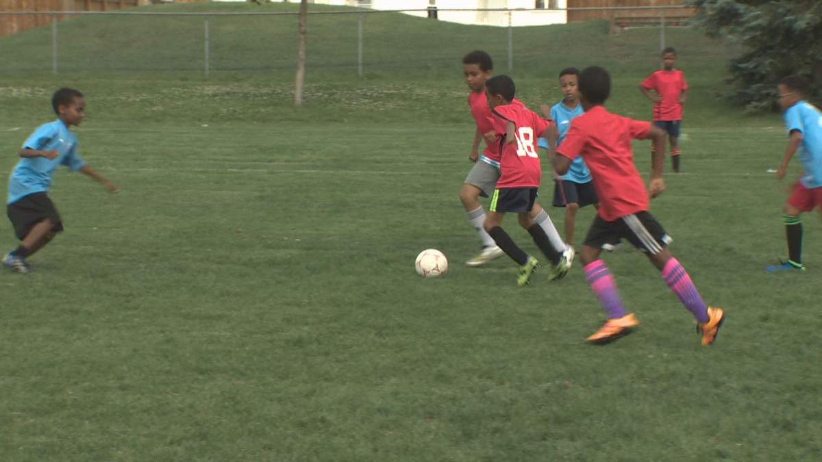Children participate in the All-African Soccer Tournament .