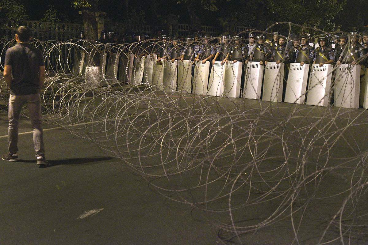 Armenian police block a street leading to Erebuni police station seized by gunmen - supporters of fringe jailed opposition leader Zhirair Sefilyan - in Yerevan early on July 31, 2016. 