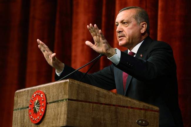 Turkey President Recep Tayyip Erdogan delivers a speech commenting on those killed and wounded during a failed July 15 military coup, in Ankara, Turkey, late Friday, July 29, 2016. 