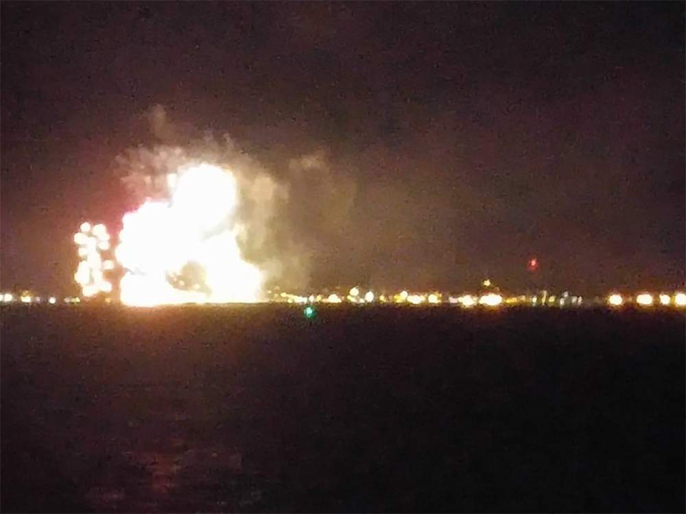 A barge carrying a load of fireworks caught fire Monday.