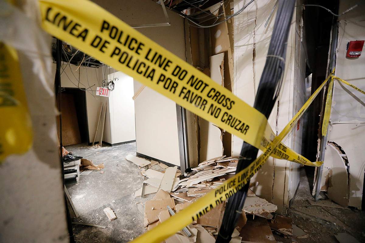 Damage from a blast is shown in a hallway at El Centro College downtown campus, Tuesday, July 19, 2016, in Dallas. 