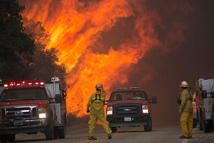 Firefighters are forced to retreat as flame close in on them in Placerita Canyon at the Sand Fire on July 24, 2016 in Santa Clarita, California.