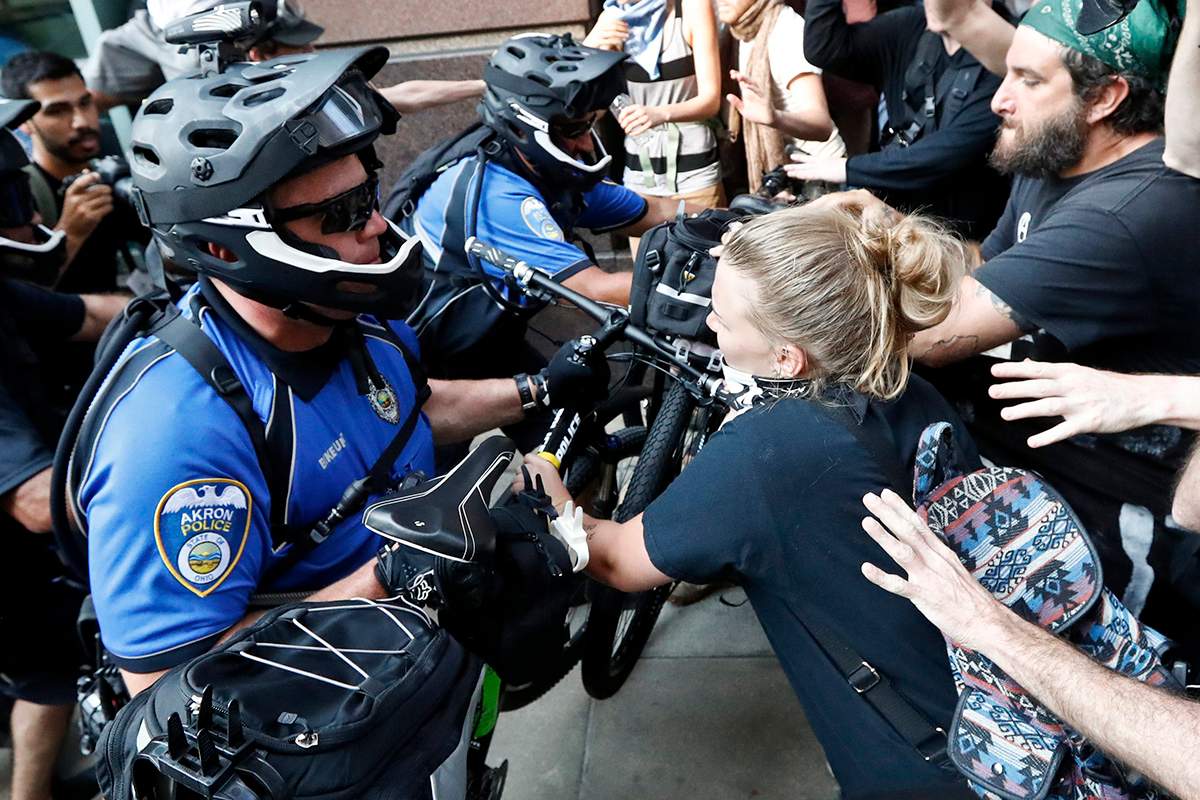 Protesters clash with police on Tuesday, July 19, 2016, in Cleveland, during the second day of the Republican convention.
