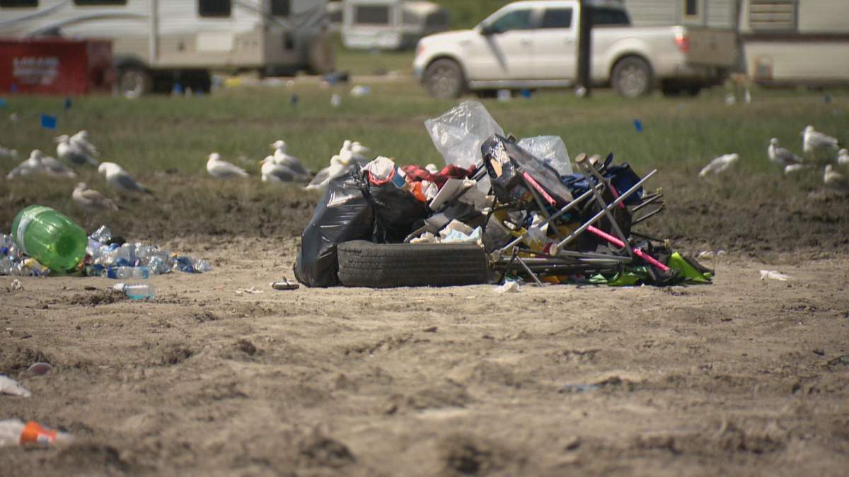 A wrecked tire and chair are just some of the items discarded in this pile of trash.