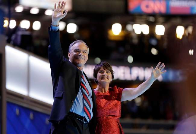 Democratic vice presidential candidate, Sen. Tim Kaine waves with his wife Anne Holton during the third day session of the Democratic National Convention in Philadelphia, Wednesday, July 27, 2016.