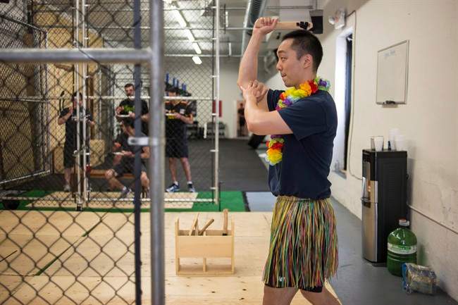 Howard An, who is getting married in October, has fun with his friends at an Axe Throwing club as part of his bachelor party, in Toronto on Saturday July 9 , 2016. 