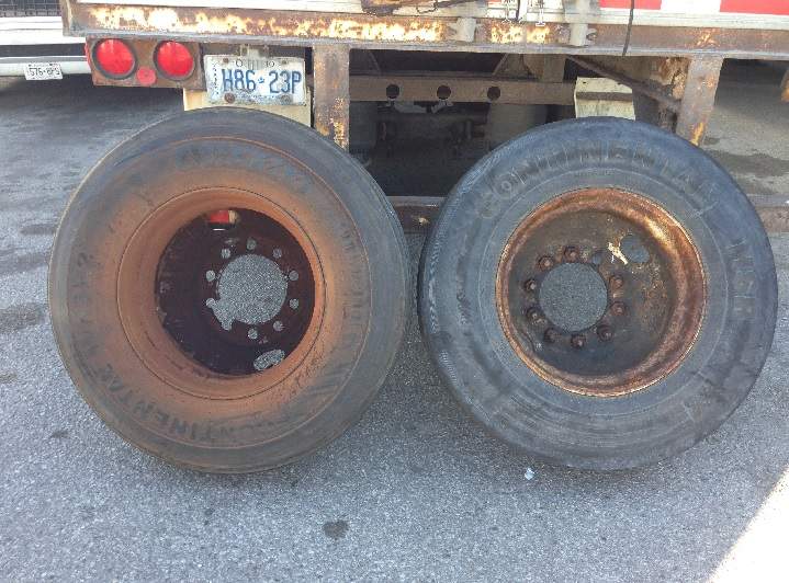 Two tires shown in a photograph after a vehicle was hit on Highway 401 on July 4, 2016.