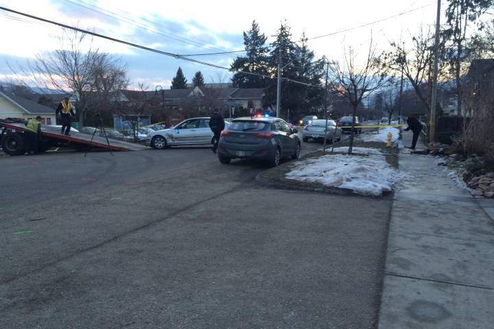 Officials tow away a vehicle after a pedestrian was hit and a driver stabbed, in Vernon, on February 10, 2016.