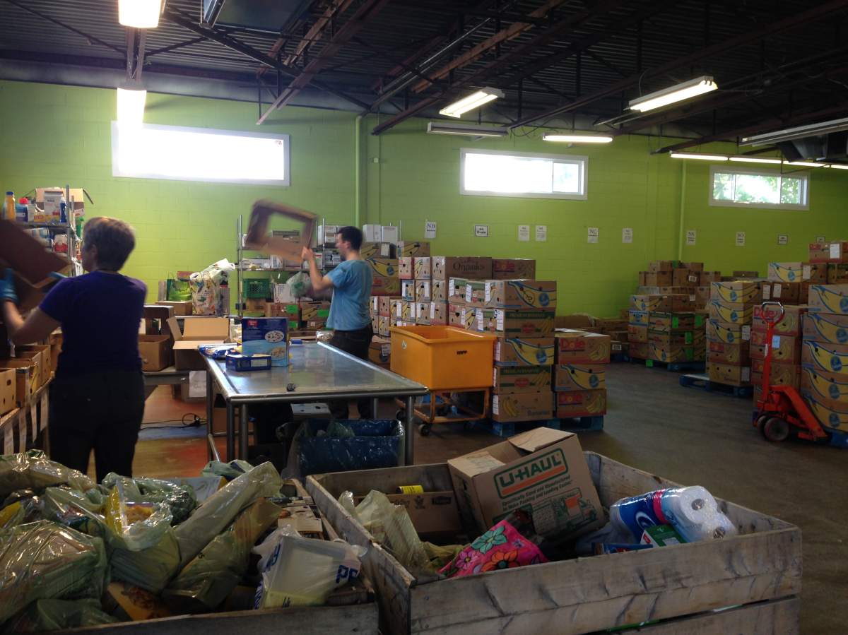Volunteers are busy sorting through donations at Feed Nova Scotia’s warehouse in Bedford.