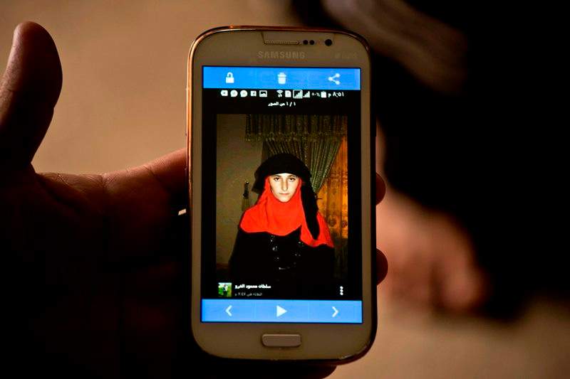Islamic State group militants took this photo of Yazidi girl Nazdar Murat, as part of a database the militants have put together of Yazidi girls and women they have enslaved, shown in this May 18, 2016, photo taken during an interview with her family at Kankhe Camp for the internally displaced in Dahuk, northern Iraq.