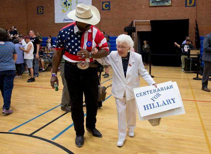 Hillary Clinton supporter Jerry Emmett carries a "centenarian for Hillary" sign at a Clinton campaign event in Phoenix in March 2016.