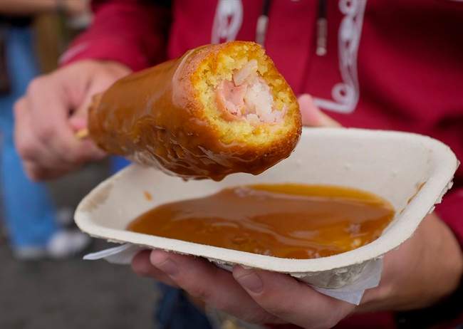A Poutine Corn Dog at the Calgary Stampede in Calgary, Saturday, July 9, 2016.