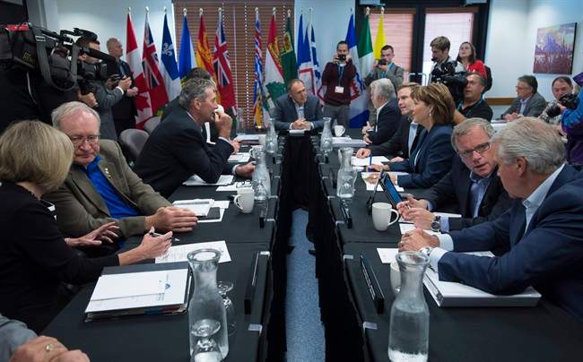 Provincial premiers are seen at the beginning of their meeting in Whitehorse, Yukon, Thursday, July, 21, 2016.