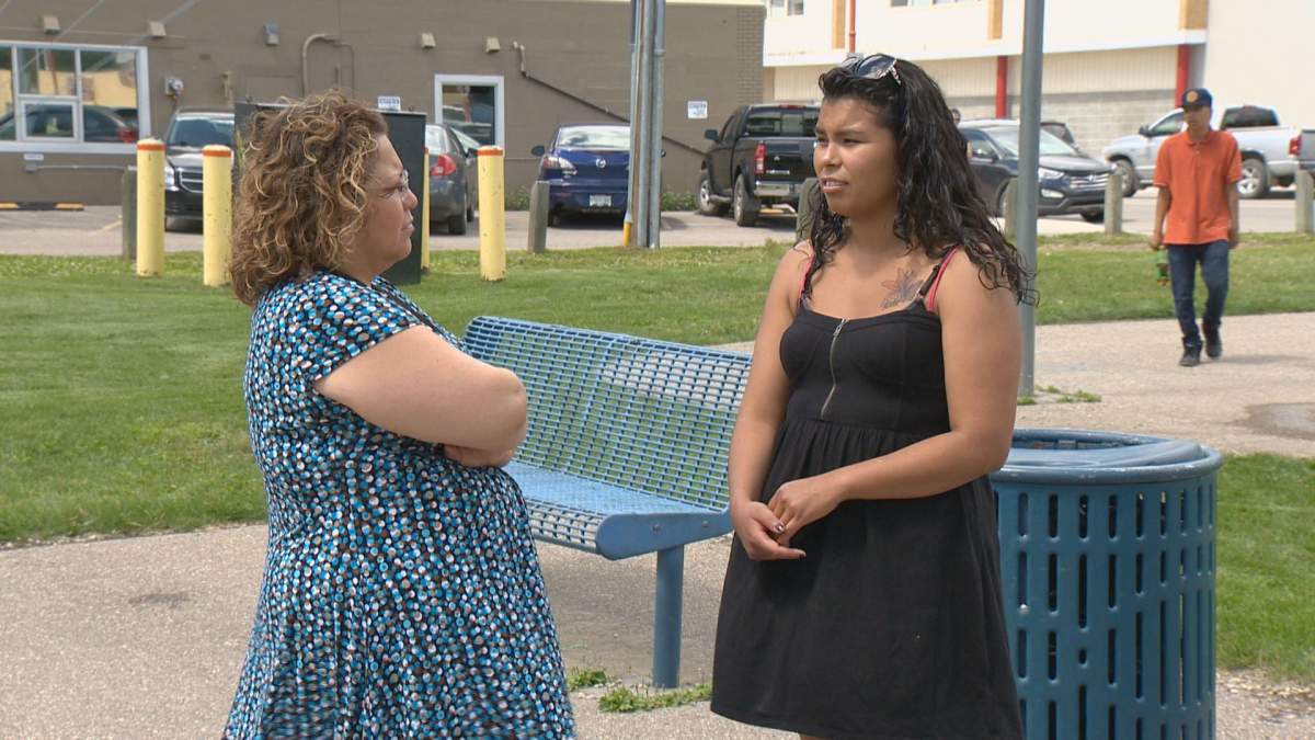 Tamra’s sister, Summer Fable (right), talks with one of the BBQ’s organizers Erica Beauden.