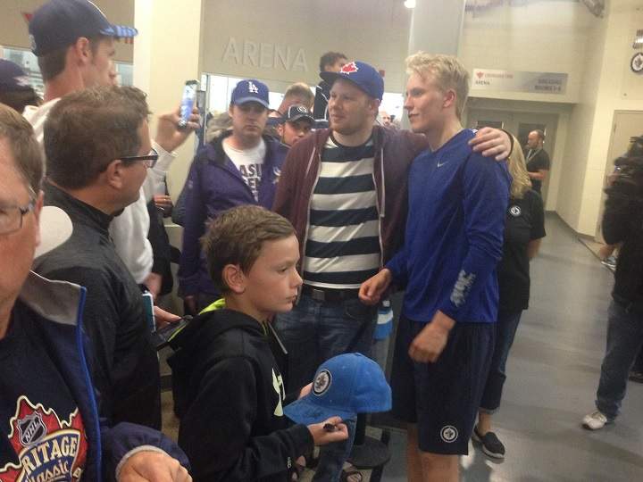 Patrik Laine poses for a picture at the MTS Iceplex on Sunday.