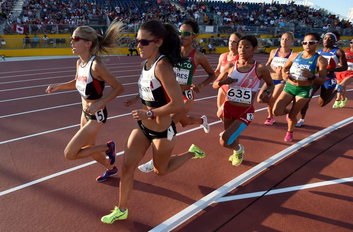 Canadian teammates Natasha Wodak, left, and Lanni Marchant, second left, run in the women’s 10000m final during the athletics competition at the 2015 Pan Am Games in Toronto on Thursday, July 23, 2015.