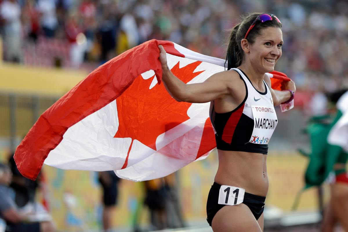 Canada’s Lanni Marchant celebrates after winning the bronze medal in the women’s 10,000 meter run at the Pan Am Games in Toronto, Thursday, July 23, 2015.