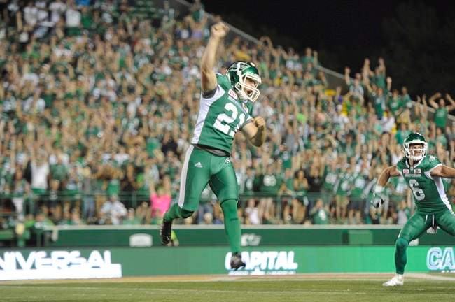 Saskatchewan Roughriders kicker Tyler Crapigna celebrates after kicking the game-winning field goal against the Ottawa Redblacks during CFL action in Regina on Friday, July 22, 2016.