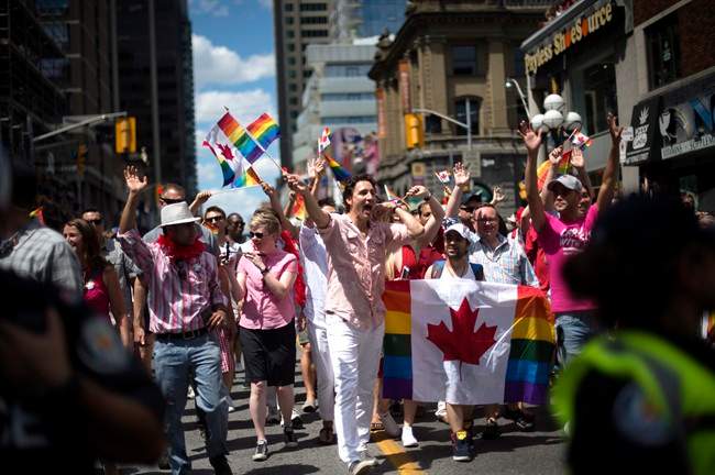 Prime Minister Justin Trudeau waves to spectators at the annual Pride Parade in Toronto on July 3. Trudeau is also showing his support for the Pride march in Steinbach this weekend. 