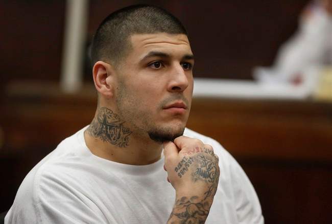 Former New England Patriots NFL football player Aaron Hernandez attends a pre-trial hearing at Suffolk Superior Court in Boston, Dec. 22, 2015.