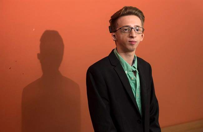 Jeremy Gabriel arrives at a news conference Thursday, July 21, 2016 in Montreal. Quebec comedian Mike Ward has been ordered to pay $35,000 in moral and punitive damages to a young artist for jokes about his singing and his disfigurement.