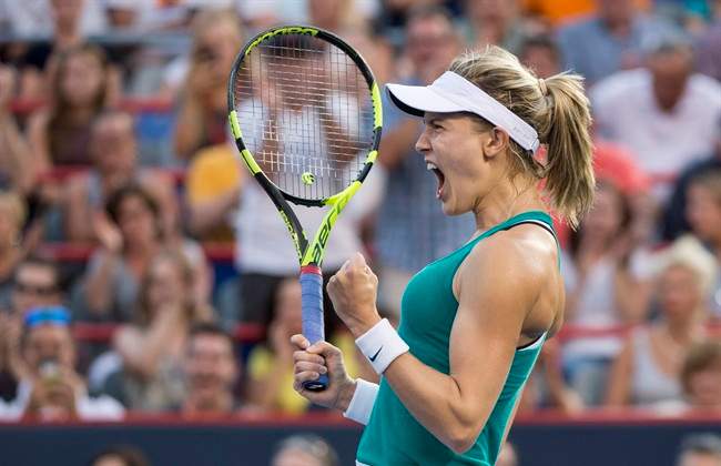 Eugenie Bouchard of Canada celebrates her victory over Dominika Cibulkova of Slovakia during second round of play at the Rogers Cup tennis tournament Wednesday July 27, 2016 in Montreal. Researchers looked at over 8,000 Grand Slam tennis games – including matches from the Australian Open, the US Open, the French Open, and Wimbledon – factoring in the multi-million dollar prizes at stakes for athletes. THE CANADIAN PRESS/Paul Chiasson.