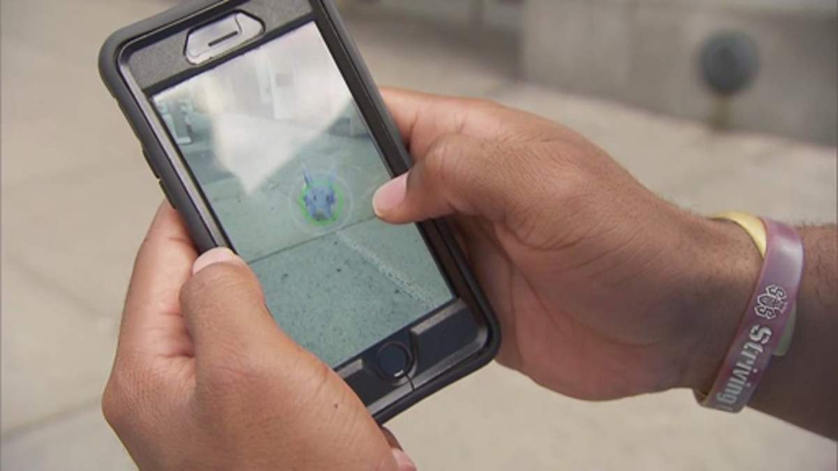 Playing Pokemon Go.
