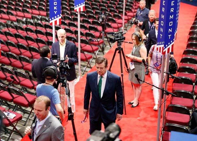 Then-Trump campaign chairman Paul Manafort walks off the floor of the Republican National Convention at Quicken Loans Arena after talking to reporters, Sunday, July 17, 2016, in Cleveland.