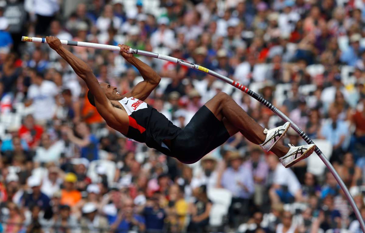Canada's Damian Warner competes in the men's decathlon pole vault event at the London 2012 Olympic Games at the Olympic Stadium August 9, 2012.   REUTERS/Phil Noble (BRITAIN  - Tags: OLYMPICS SPORT ATHLETICS)   - RTR36IRF.