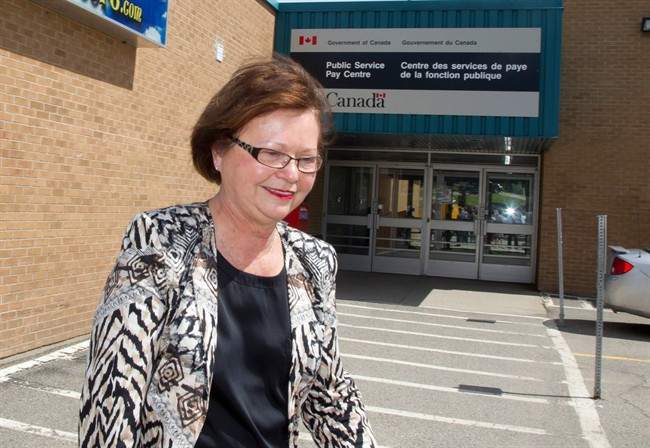 Public Services Minister Judy Foote leaves after speaking to the media in Miramichi, N.B., on Wednesday, July 27, 2016. Foote is stepping away from her job temporarily.