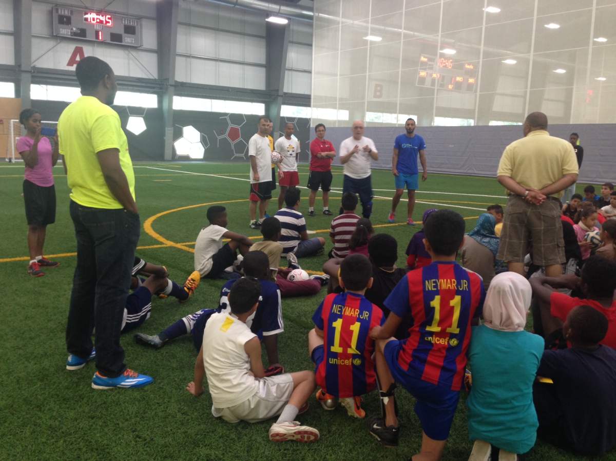 Pep-talk for the kids at soccer summer camp.