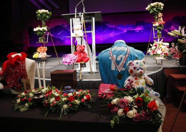 Flowers and teddy bears arranged at the memorial service for Sara Baillie and her daughter Taliyah Marsman in Calgary, Alta., Thursday, July 21, 2016.