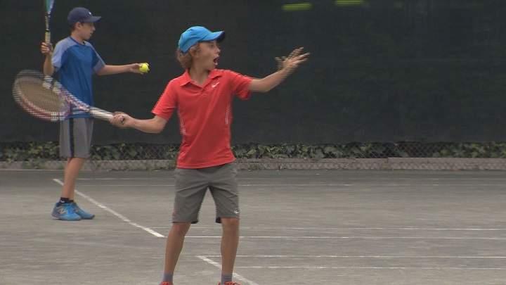 Kids playing tennis at the Monkland Tennis Club, July 8, 2016.