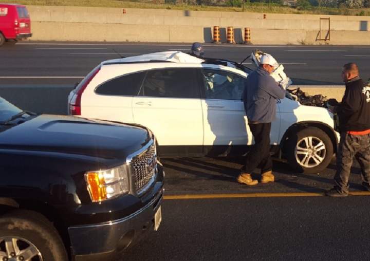 A white Honda SUV was apparently struck by a tire on Highway 401 in Toronto on July 4, 2016.