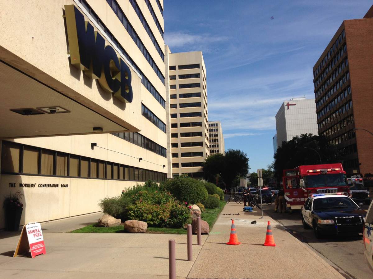 A large emergency crew presence outside the Workers' Compensation Board building at 9912 107 St NW in downtown Edmonton, where a man lit himself on fire Friday morning. July 15, 2016.
