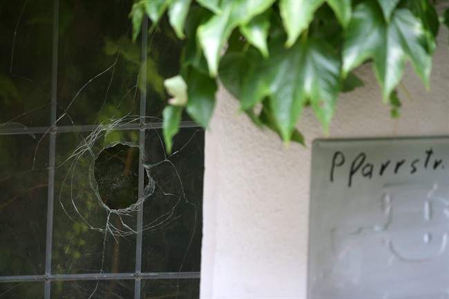 A broken window photographed at the site of the attack in Ansbach, Germany, Tuesday July 26, 2016. In the most recent attack in Germany, a 27-year-old Syrian asylum-seeker set off a backpack laden with explosives and shrapnel Sunday night after being refused entry to a crowded music festival in the Bavarian city of Ansbach, killing himself and wounding 15 people. (Daniel Karmann/dpa via AP).
