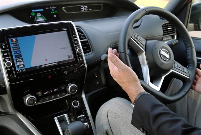 A draft vehicle technology bill was tabled by the UK government suggesting that self-driving cars and their manufacturers should be liable for accidents, not the person sitting behind the wheel. (AP Photo/Shizuo Kambayashi).