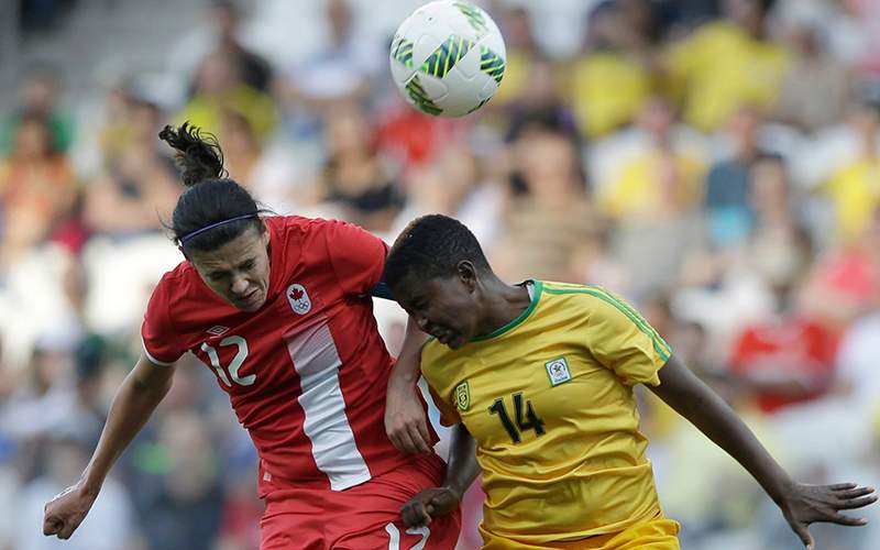 Canada's Christine Sinclair, left, and Zimbabwe's Eunice Chibanda go for a header during a group F match of the women's Olympic football tournament between Canada and Zimbabwe in Sao Paulo, Brazil, Saturday, Aug. 6, 2016. 