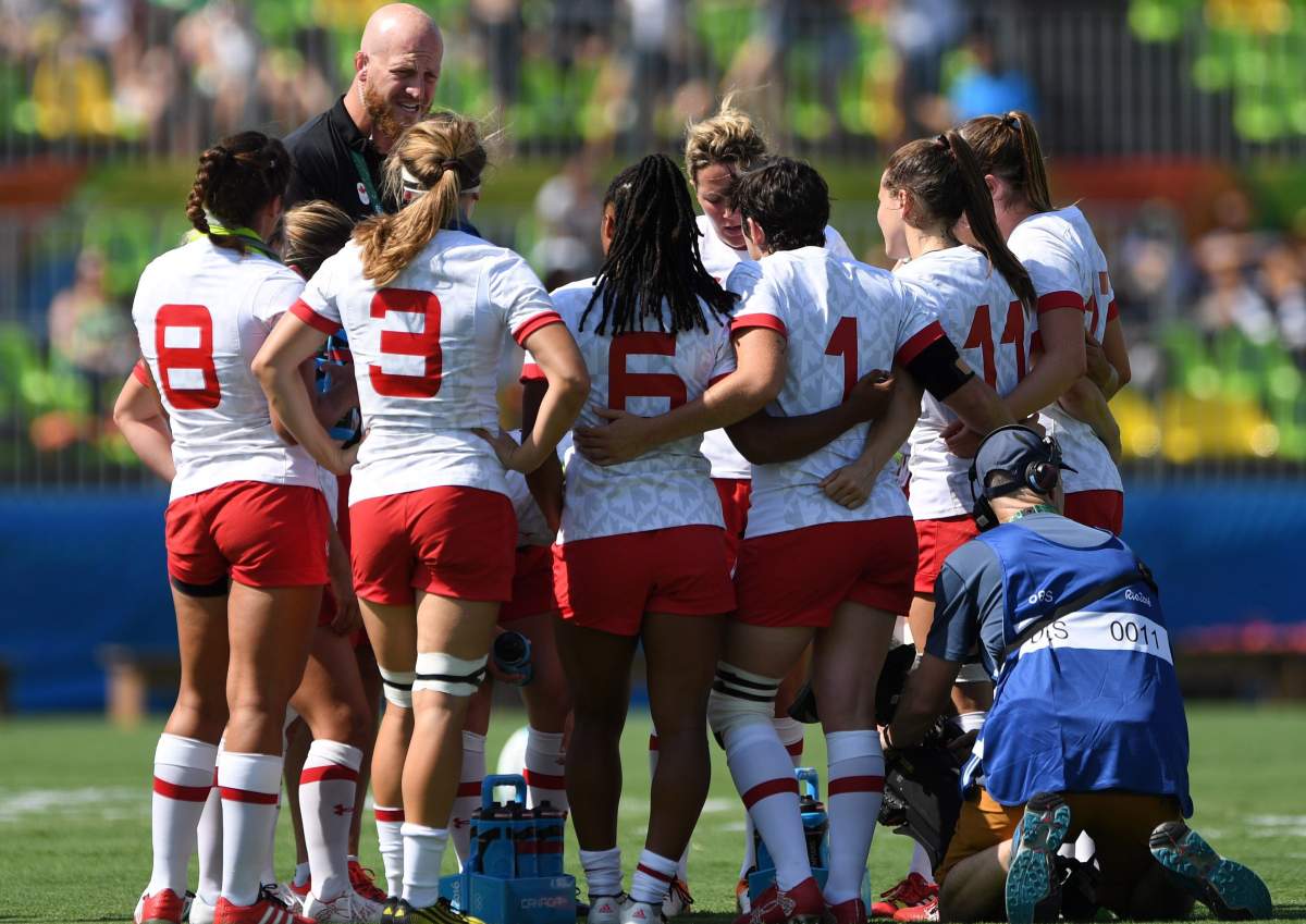 Head coach John Tait talks to his team as Canada takes on Japan in women’s sevens rugby action at the 2016 Olympic Games in Rio de Janeiro, Brazil on Saturday, Aug. 6, 2016.