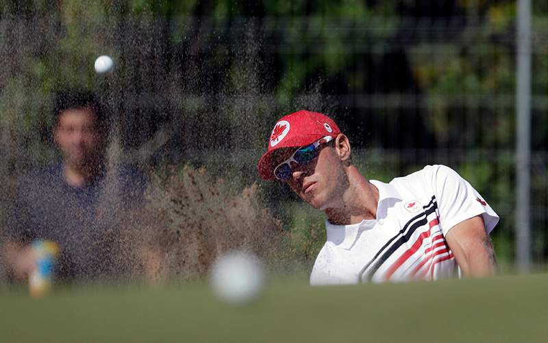 Graham DeLaet of Canada, hits up to the 10th green during the third round of the men’s golf event at the 2016 Summer Olympics in Rio de Janeiro, Brazil, Saturday, Aug. 13, 2016.