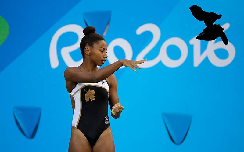 Canada’s Jennifer Abel throws her towel into the pool as she competes during the women’s 3-meter springboard diving semifinal in the Maria Lenk Aquatic Center at the 2016 Summer Olympics in Rio de Janeiro, Brazil, Saturday, Aug. 13, 2016.