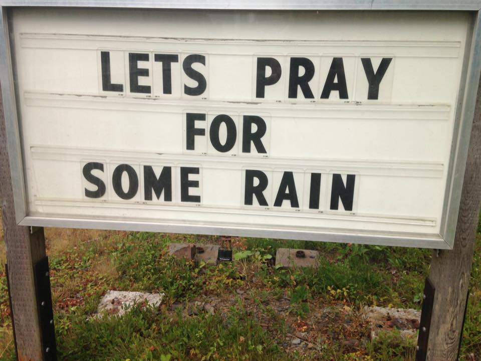 A sign near Kejikjukik National Park reads “lets pray for some rain” as the province battles several wildfires throughout Nova Scotia.