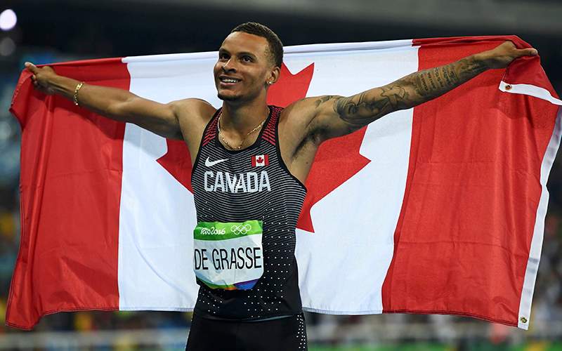 Bronze medalist Andre De Grasse of Canada celebrates after the 100m final.