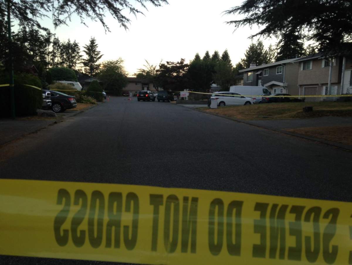 Investigators on scene following a shooting in Abbotsford on Aug. 17.